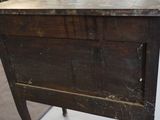an old wooden table with a drawer on top of it