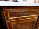 a close up of a cabinet with a marble top
