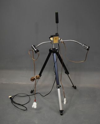 a tripod with a camera on it on a tripod