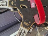 a close up of a piece of luggage with a red strap on it