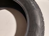 a close up of a tire on a white surface