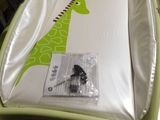 a baby bed with a giraffe design on it