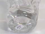 a clear glass vase with a label on it