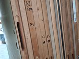 many wooden doors with numbers on them in a room