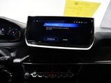 a car dashboard with a digital display and a steering wheel