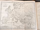 an old map of europe and the middle east is shown in a book