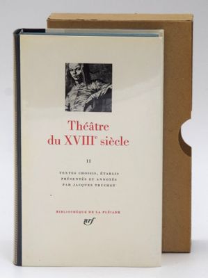 the book is sitting in a cardboard box on a white surface