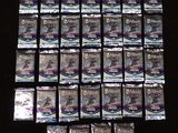 many packets of toothpaste sitting on a table