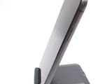a cell phone that is sitting on top of a stand
