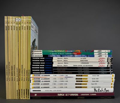 many books stacked on top of each other on a table
