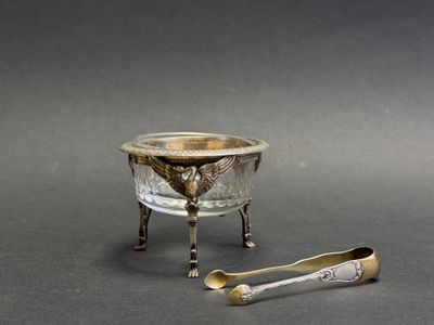 two spoons and a bowl sitting on a table