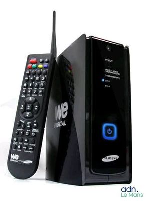 a remote control sitting next to a box with a remote