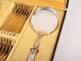 a silverware set in a box with a spoon and fork in it