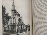 an open book with a black and white photo of a church