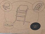 a cardboard box with a picture of a baby ' s highchair