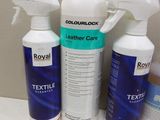 three bottles of leather care sitting on top of a white counter