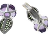 purple and silver flower earrings with green crystals on a white background