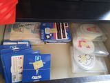 a drawer full of medical supplies on the counter