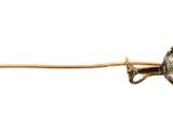 a gold pin with a diamond on it on a white background