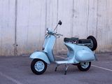 a scooter that is parked in a parking lot