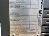 an image of a close up of a metal plate on a machine