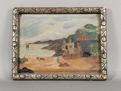 tableau représentant une scène de plage, dans un cadre argenté, accroché à un mur blanc