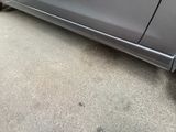 a car that is parked on the side of the street