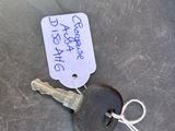 a key with a tag attached to it sitting on a table