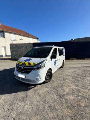 a white van parked in front of a house with a blue sky in the background