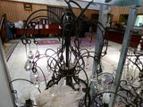 a chandelier that has a lot of glass hanging from it