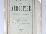 an old book with writing on it sitting on a table