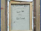 an old picture frame with writing on a blue wall with a green marker