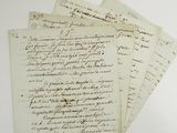 three old letters are sitting on top of each other on a table