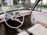 a pink and white car with a steering wheel and dashboard