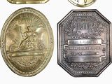 four different types of coins are shown on a white surface