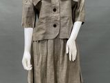 an image of a mannequin wearing a brown dress and jacket