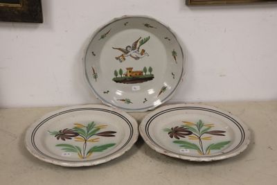 three plates that are sitting on a table