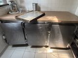 a kitchen with a stove, dishwasher, and refrigerator in it
