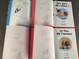 four children ' s books with pictures of dogs and cats on them