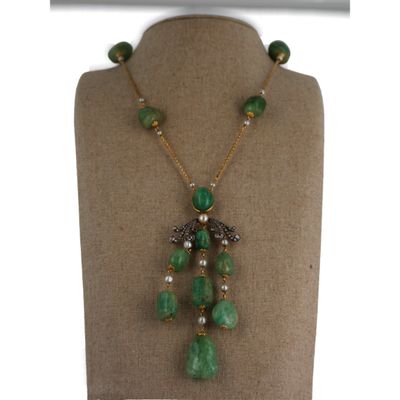 a close up of a mannequin with a necklace on it