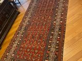 a long rug on the floor in a living room