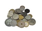 a pile of old coins on a white surface