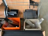 many different items in a box on the floor
