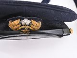 a hat with a badge on it sitting on a table