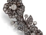 a close up of a necklace on a white surface