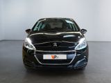 the front view of a black car in a showroom