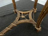 an image of a table with a glass top on a carpeted floor