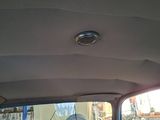 a view of the inside of a car from the driver ' s seat