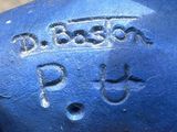 a close up of a blue fire hydrant with writing on it
