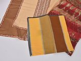 several different colors of fabric are laid out on a table